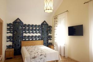 Ένα ή περισσότερα κρεβάτια σε δωμάτιο στο Uzkanaves 15