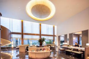 Zona de estar de Atour Hotel Central China Normal University Wuhan Street Entrance