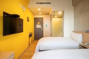 En TV eller et underholdningssystem på CHECK inn Express Taichung Yizhong