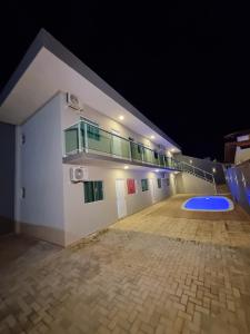 a large empty building with a basketball court at night at Flat Praia Dourada 5 in Maragogi