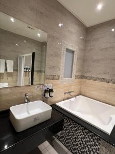 Bilik mandi di Wei Feng Exquisite Motel Pintung Branch