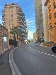 an empty street in a city with tall buildings at Studio 36mt2 a 5 min a pied boulevard de Belgique MC in Beausoleil