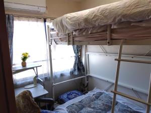 Postel nebo postele na pokoji v ubytování OSO Homestay