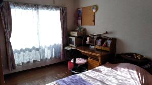 Postel nebo postele na pokoji v ubytování OSO Homestay