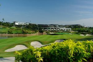 a view of a golf course with a green at Peaceful Escape Near IOI Mall Putrajaya in Sepang
