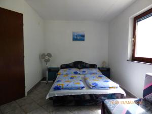 Postel nebo postele na pokoji v ubytování Fábián Apartman-ház