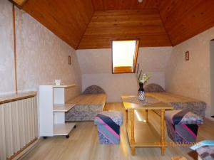 Postel nebo postele na pokoji v ubytování Fábián Apartman-ház
