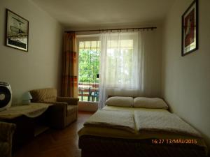 Postel nebo postele na pokoji v ubytování Fábián Apartman-ház