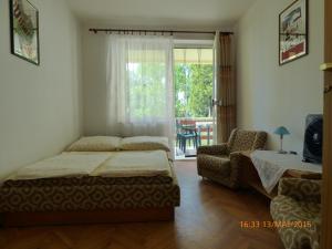 Postel nebo postele na pokoji v ubytování Fábián Apartman-ház