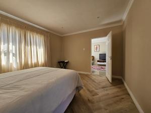 Ένα ή περισσότερα κρεβάτια σε δωμάτιο στο Walmer Hideaway +7 φωτογραφίες