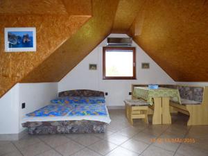 Postel nebo postele na pokoji v ubytování Fábián Apartman-ház