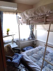 Postel nebo postele na pokoji v ubytování OSO Homestay