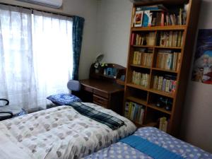Postel nebo postele na pokoji v ubytování OSO Homestay