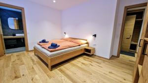 a bedroom with a bed in a room at Silberdistel Brand-new luxury apartment with private terrace in Saas-Fee