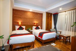 Postel nebo postele na pokoji v ubytování Taleju Boutique Hotel