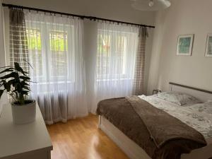 Posteľ alebo postele v izbe v ubytovaní Apartman 825