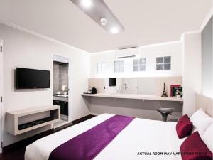 Ένα ή περισσότερα κρεβάτια σε δωμάτιο στο The Step Sathon