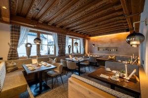 Reštaurácia alebo iné gastronomické zariadenie v ubytovaní Boutique Hotel Montanara