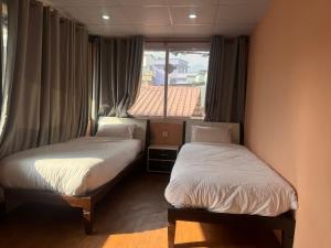 Cama ou camas em um quarto em Birds Nest Hostel