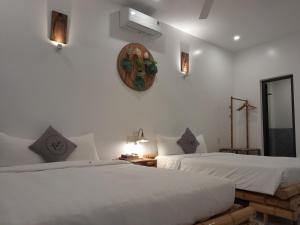 Postel nebo postele na pokoji v ubytování Tâm Homestay