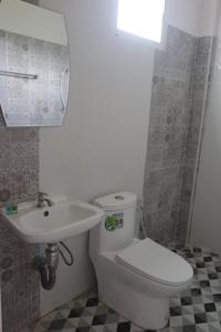 a bathroom with a toilet and a sink at P&G leampom hotel in Ban Chao Nam +36 photos