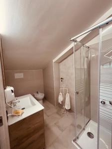 a bathroom with a shower and a sink and a toilet at La Bellavista Castello in Melfi +58 photos
