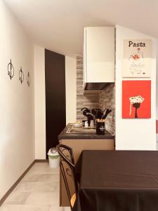 a kitchen with a sink and a counter top at La Bellavista Castello in Melfi
