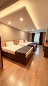 a bedroom with two beds in a room at The Green Park Taksim in Istanbul