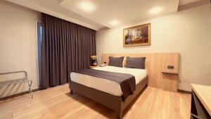 a bedroom with a large bed in a room at The Green Park Taksim in Istanbul