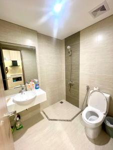 a bathroom with a toilet and a sink at Vinhomes Smart City Tây Mỗ Nam Từ Liêm in Hanoi +16 photos
