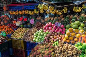a market with lots of fruits and vegetables on display at Phuchada Residence in Nai Yang Beach +48 photos