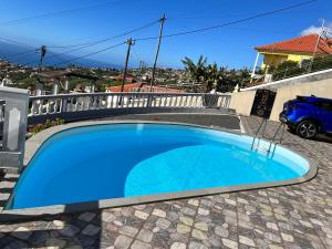 a swimming pool in the backyard of a house at La terraza de Ponta do Sol -Suite 1 in Ponta do Sol