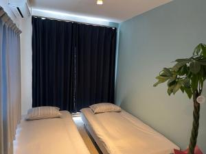 Postelja oz. postelje v sobi nastanitve Ns Home 南名古屋一軒家ルームシェア-3G