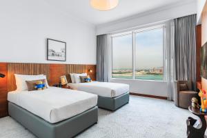 Katil atau katil-katil dalam bilik di Somerset West Bay Doha +17 gambar