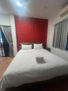Postel nebo postele na pokoji v ubytování Nine Blue Garden Villa
