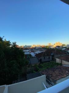 a view of the city from the roof of a building at Loft central com garagem in Pelotas +4 photos