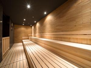 an empty bowling alley with lights on the wall at APA Hotel & Resort Osaka Namba Ekimae Tower in Osaka