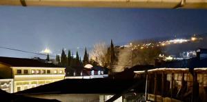 a view of a city at night with a city at Old city Apartment 1 in Tbilisi City +30 photos