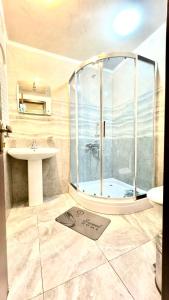 a bathroom with a shower and a sink at Old city Apartment 1 in Tbilisi City
