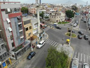 an aerial view of a city street with cars at Hotel Palmas Reales in Trujillo +23 photos
