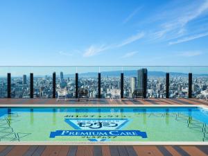 a swimming pool on the roof of a building at APA Hotel & Resort Osaka Namba Ekimae Tower in Osaka