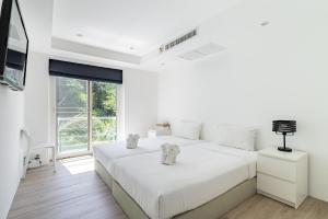 Giường trong phòng chung tại Kata Ocean View Condominium +28 ảnh
