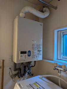 a hospital room with a large tank above a sink at 1棟貸し Villa YOU hokkaido date toya in Date +21 photos