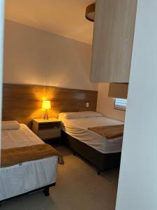 Postel nebo postele na pokoji v ubytování Apto condomínio Terra Mater