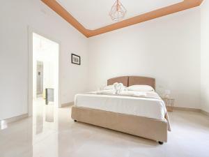 Postel nebo postele na pokoji v ubytování FeVi Rooms