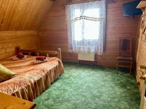 Voodi või voodid majutusasutuse Хата Магната та Смерекова Хата toas