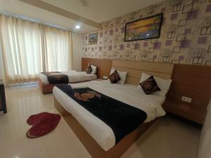 Postel nebo postele na pokoji v ubytování Hotel Grand Suites By D'Capitol Near IGI Airport