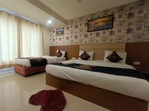 Postel nebo postele na pokoji v ubytování Hotel Grand Suites By D'Capitol Near IGI Airport