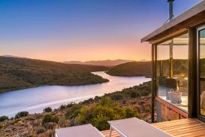 a house with a view of a river at Aardvark Bioreserve in Ladismith