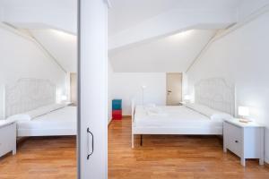 Postel nebo postele na pokoji v ubytování Cittadella Suite